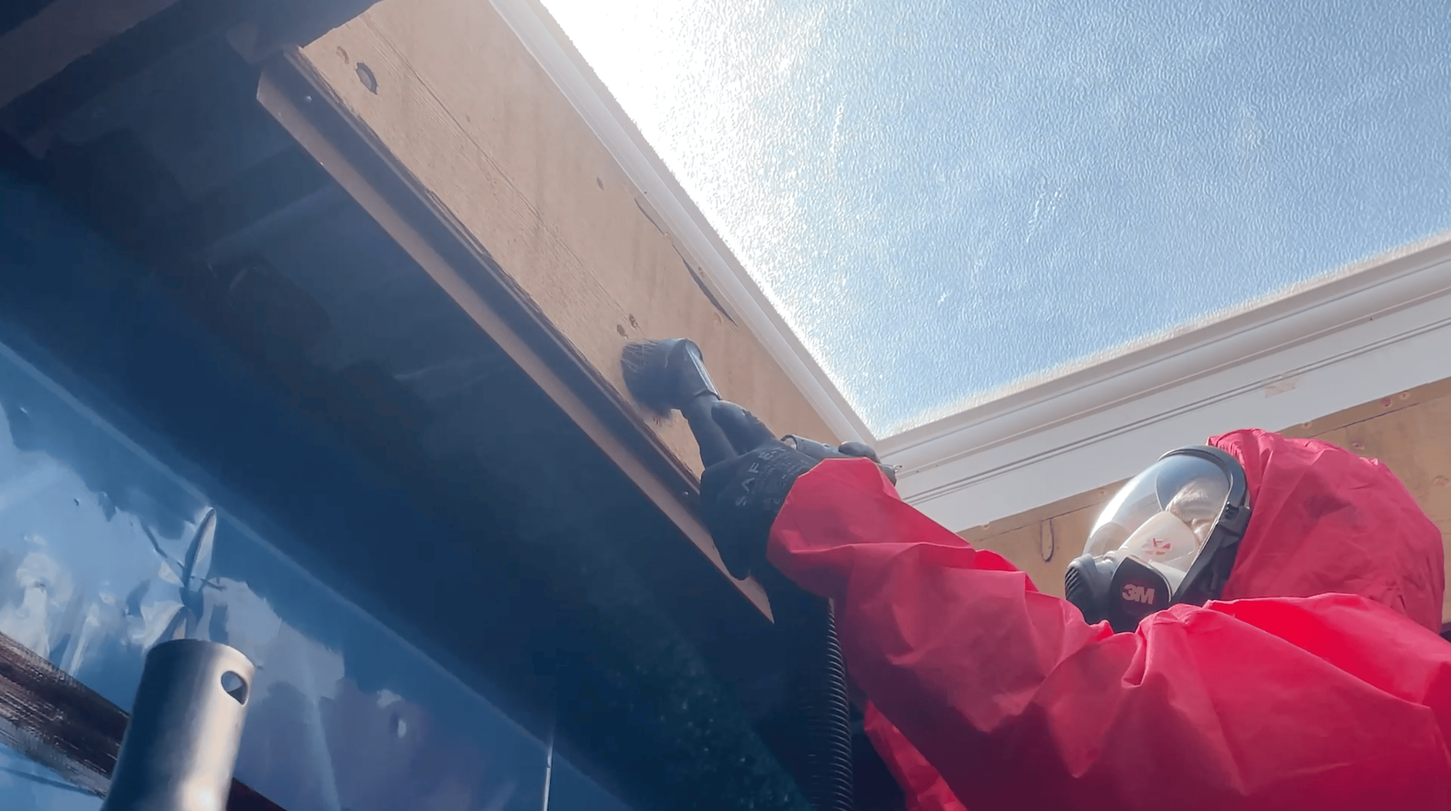 Asbestos removal operative in protective gear